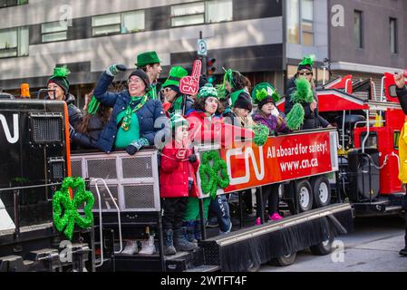 Montreal, Canada - March 17 2024： People celebrating the Saint Patrick`s Day Parade in Montreal downtown Stock Photo